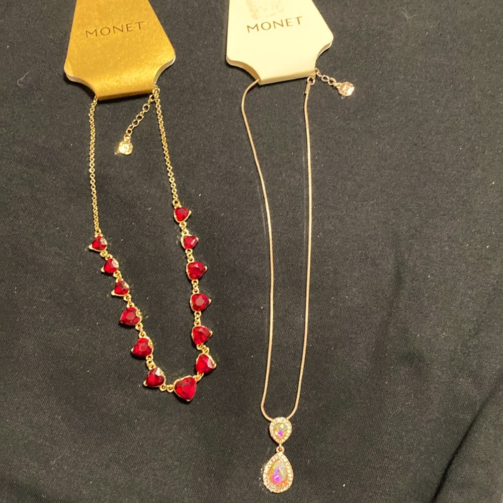 Two brand new Monet necklaces one with red hearts in gold tone settings and